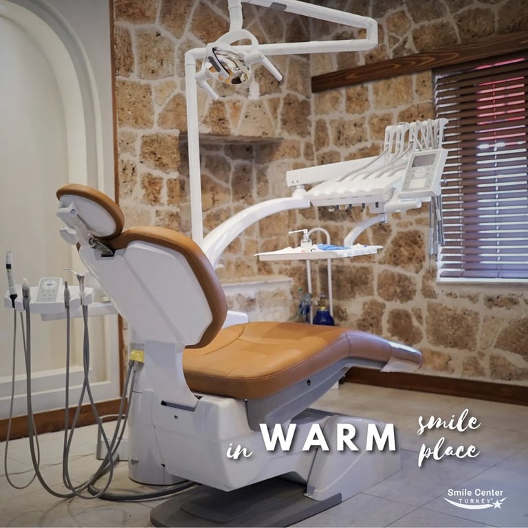 Warm-toned dental treatment room with stylish stone wall interior