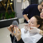 Female patient checking her smile during dental consultation at Smile Center Turkey